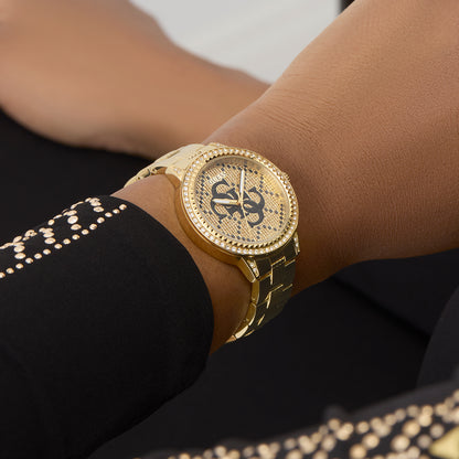 GUESS Mod. G LACE gold watch on a wrist, showcasing detailed design and luxury. Focus on GUESS Mod. G LACE accessories.