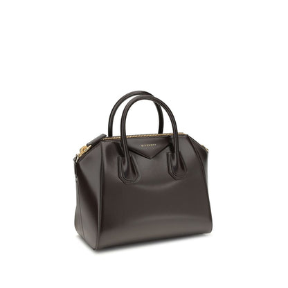Givenchy Brown Calf Leather Bos Taurus Handbag with glossy finish, features round handles, removable strap, and zipper closure.