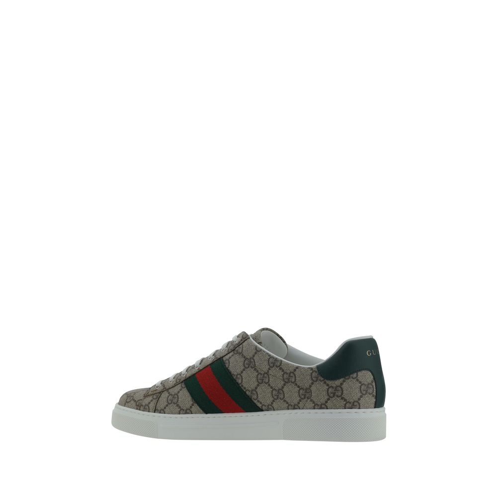 Gucci Beige Rubber Low Top Sneakers featuring lace-up closure, GG jacquard fabric, leather logo detail, and contrasting platform sole.