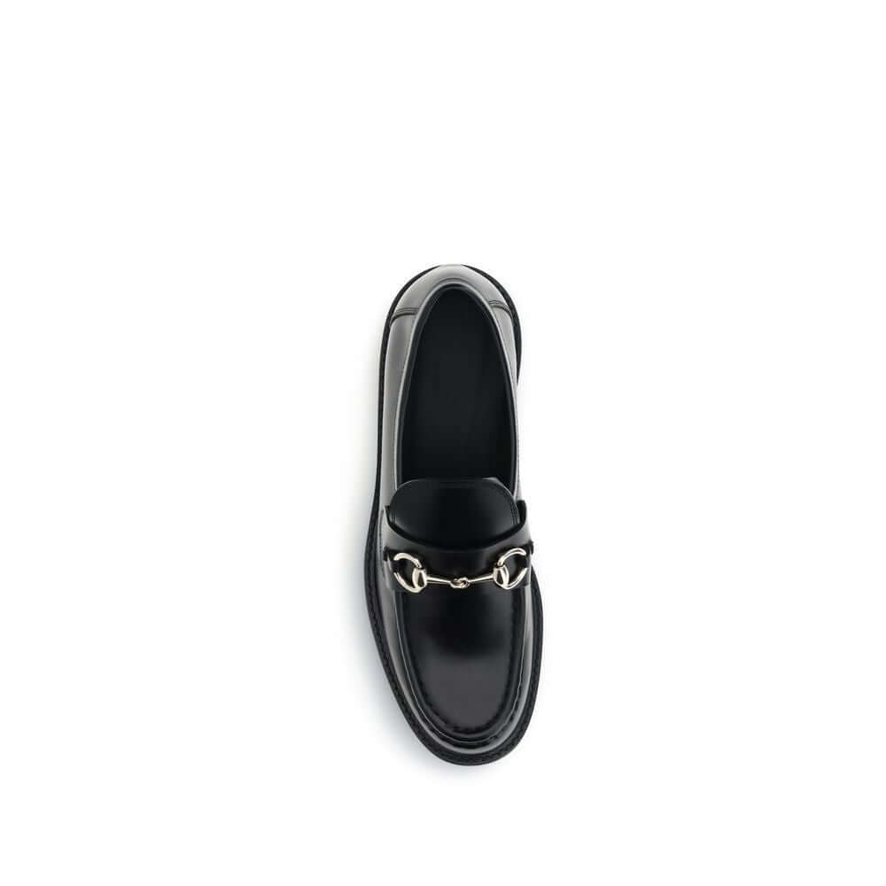 Top view of Gucci Black Calf Leather Bos Taurus Slip-On Loafers featuring iconic horsebit detail, perfect for formal and everyday looks.