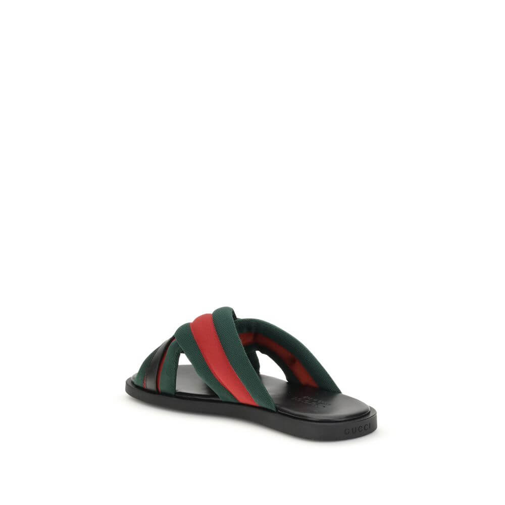 Gucci Black Polyamide Flat Sandals with green and red Web fabric and silver-tone Interlocking GG logo, side view.