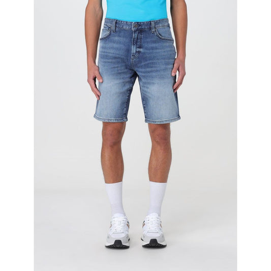 Man wearing Hugo Boss Blue Denim Shorts, size 40, featuring durable denim material and practical pockets, perfect for versatile styling.