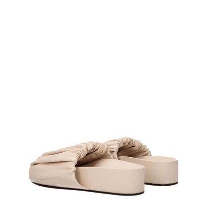 Jil Sander Pink Leather Slippers with mid heels and open toe design, made from high-quality leather for a casual style.