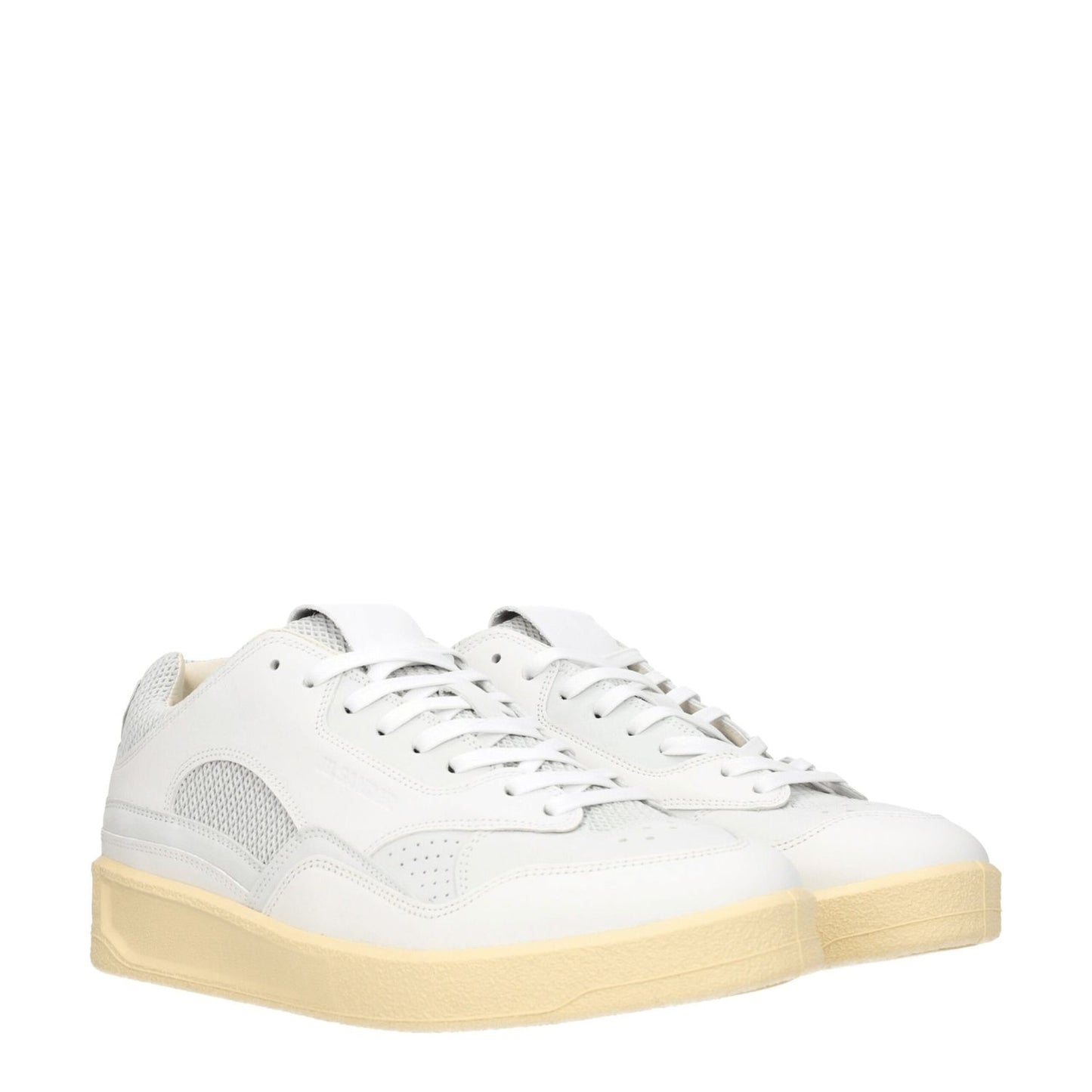 Jil Sander White Leather Low Top Sneakers with lace-up closure and beige sole, featuring a sporty glam style with round toe and mid heels.