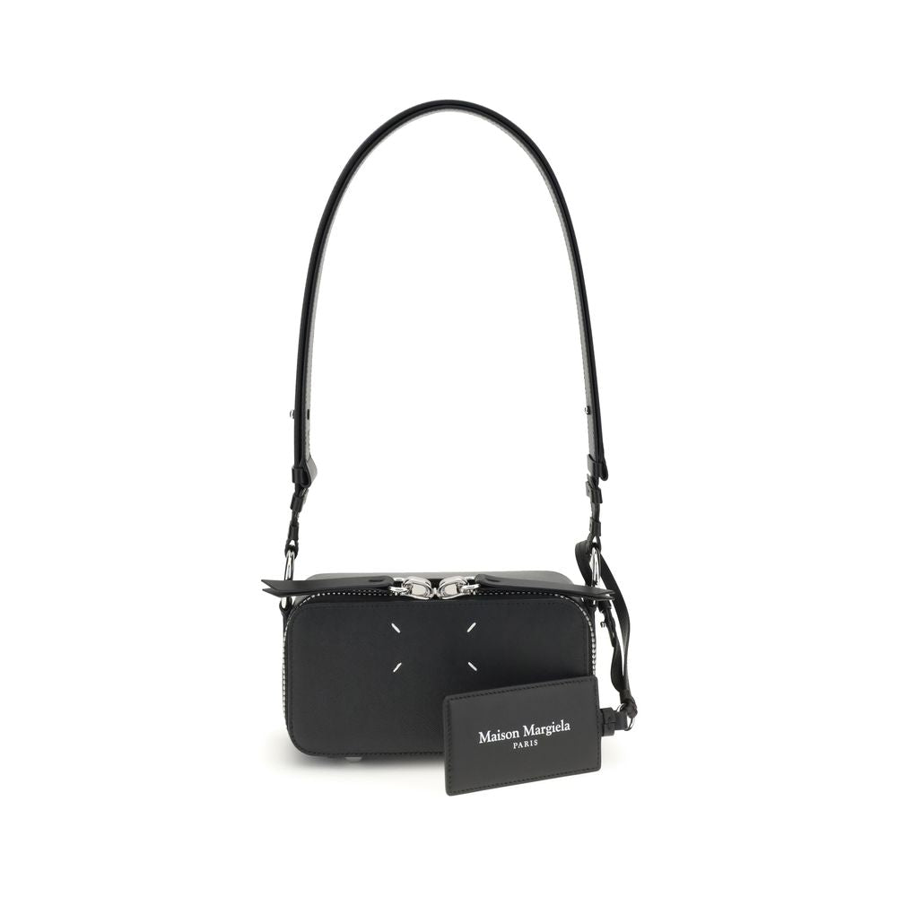 Margiela Black Calf Leather Bos Taurus Shoulder Bag with adjustable strap and zippered closure, featuring four-stitch logo.