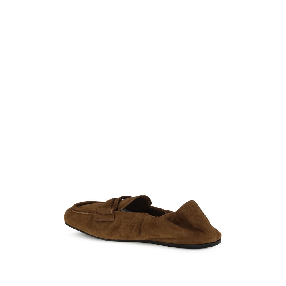 Miu Miu Brown Calf Leather Bos Taurus Slip-On Loafers with suede finish and leather horsebit, embossed logo on tongue.