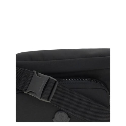 Close-up of Moncler Black Nylon Clutch Bag showing buckle and zippered pocket detail.