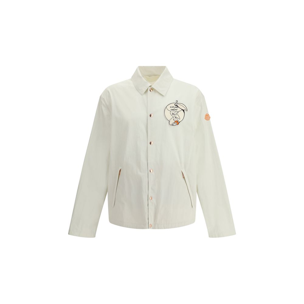 Moncler x Donald Glover White Cotton Coat with comic-style patches and embroidered details, part of the Moncler Genius line.