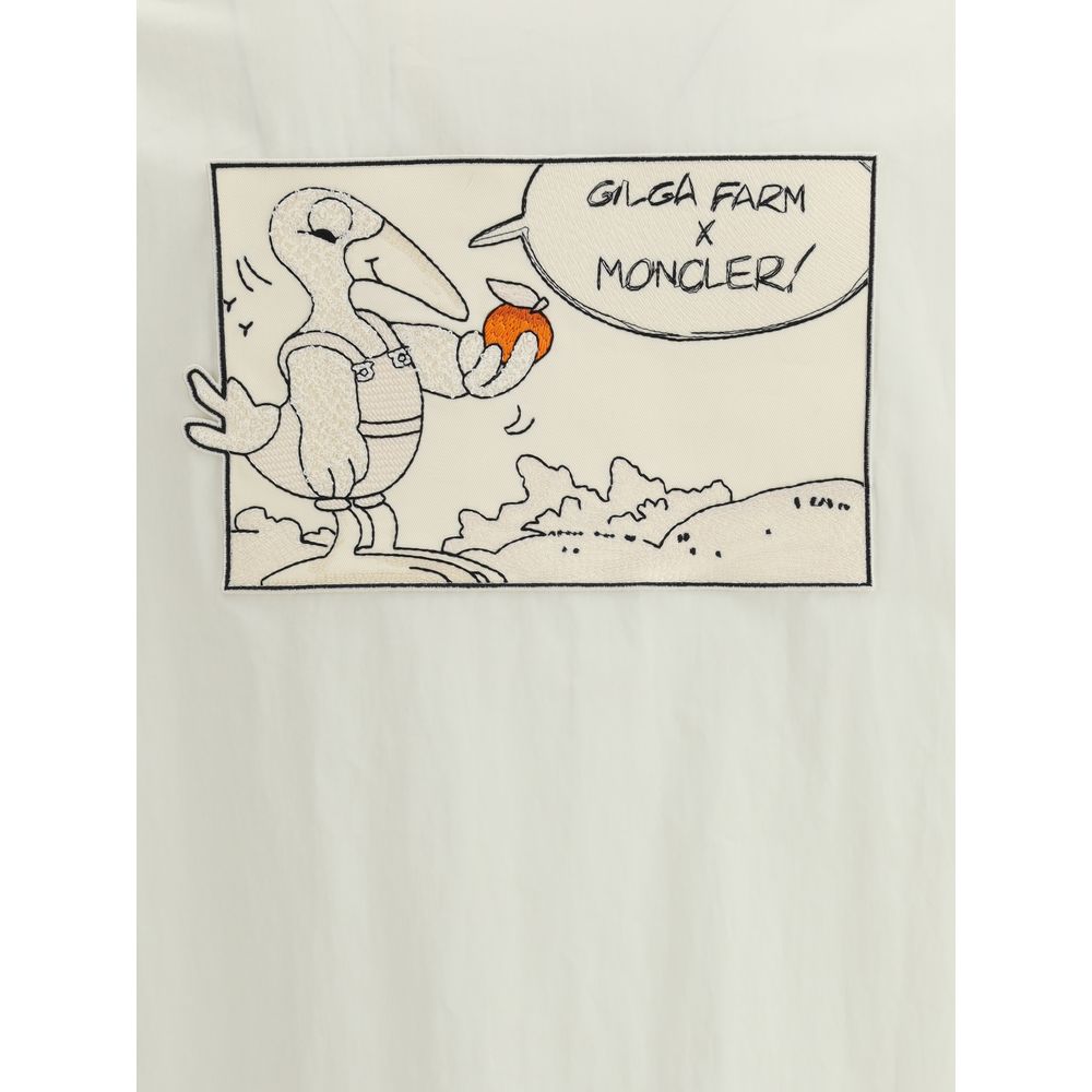 Comic-style patch on Moncler x Donald Glover White Cotton Coat featuring Gilga Farm and Moncler collaboration art.