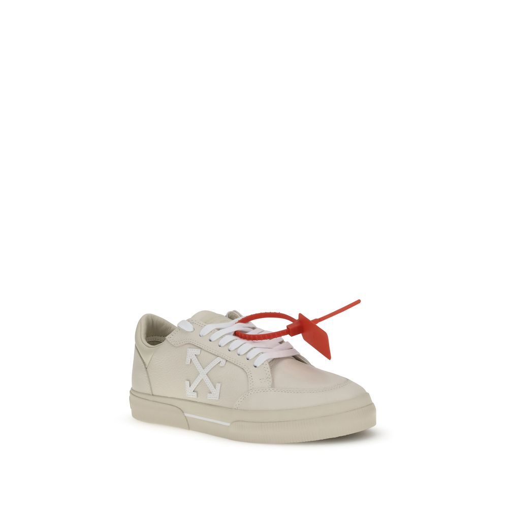 Off-White Beige Leather Low Top Sneakers with vulcanized sole and Arrow motif, featuring Zip Tie tag, AW25 collection.