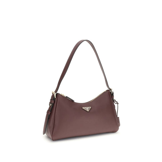 Prada Aimée Medium Shoulder Bag in brown leather with adjustable strap and iconic triangular plaque, showcasing luxury and functionality.