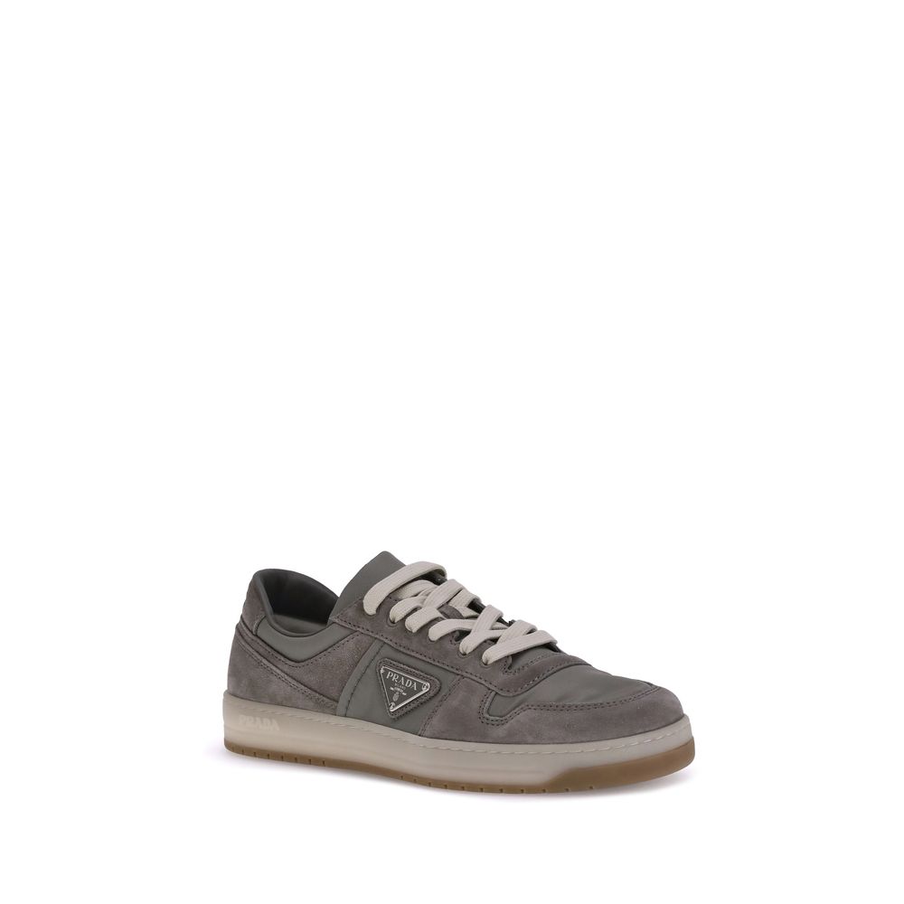 Prada Gray Calf Leather Bos Taurus Low Top Sneakers in suede material with lace-up top closure and flat sole, showcasing discreet elegance.