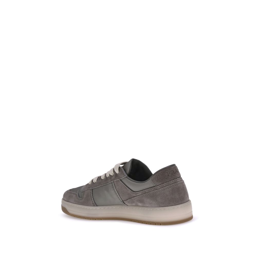 Prada Gray Calf Leather Bos Taurus Low Top Sneakers in suede leather with lace-up closure and a soft rounded toe for casual elegance.