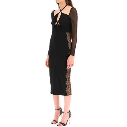 Self-Portrait Black Polyester Cocktail Dress with bow fastening and sheer long sleeves, modeled to showcase elegant evening wear.