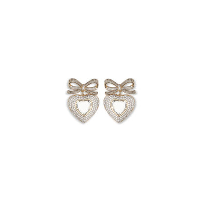 Self-Portrait Gold Brass Earrings with crystal bow and heart-shaped drop, perfect for adding elegance and romance to any outfit.