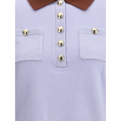 Close-up of Self-Portrait Light Blue Wool Sweatshirt with contrast collar, button closure, and pockets, showcasing a preppy style.