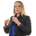 Woman wearing TED BAKER MOD. TB2274 48205 glasses, dressed in a black blazer and blue sweater, showcasing elegant eyewear for ladies.