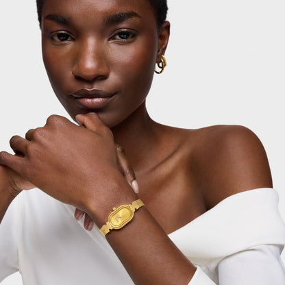 Model wearing TOUS WATCHES Mod. 3000145200, featuring a stylish gold watch on the wrist.