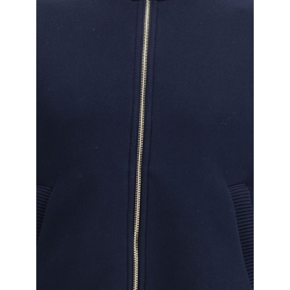 Front view of Thom Browne Blue Cotton Bomber jacket showcasing zipper and tricolor details, perfect for a modern refined look.
