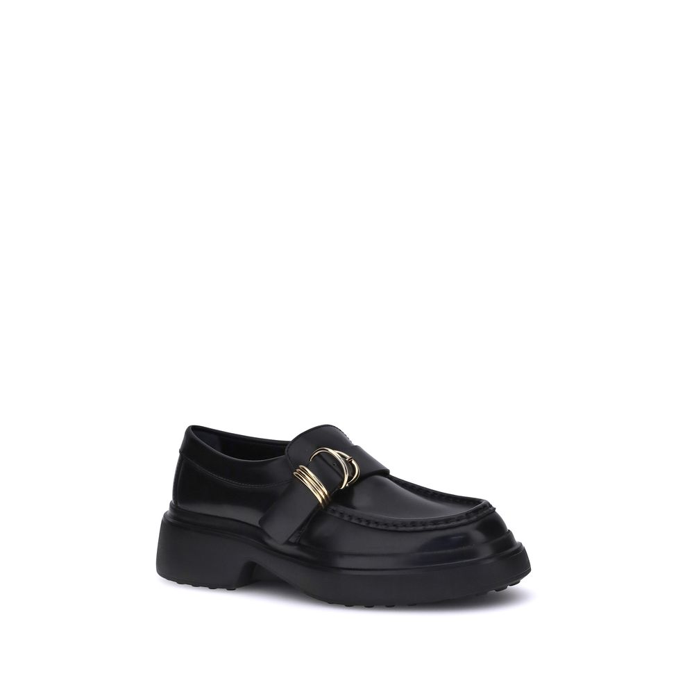 Tod's Black Rubber Platform Loafers with metal ring embellishments and nappa leather for a refined, contemporary style.