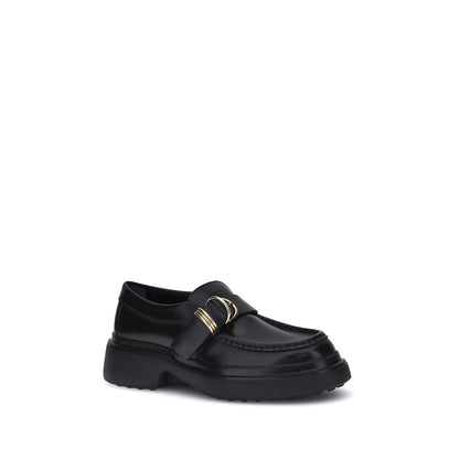 Tod's Black Rubber Platform Loafers with metal ring embellishments and nappa leather for a refined, contemporary style.