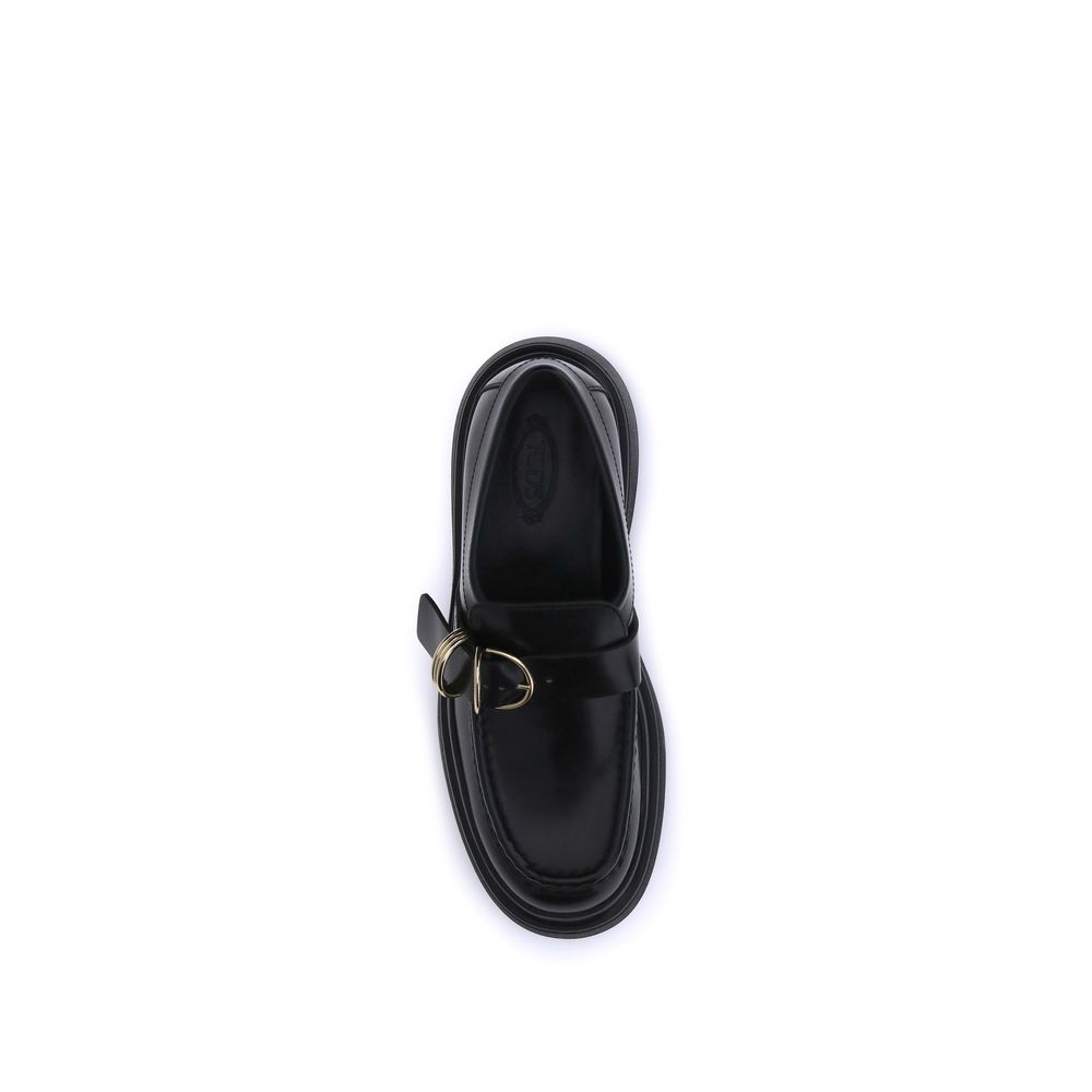 Top view of Tod's Black Rubber Platform Loafers with metal rings and elegant design for a contemporary style.