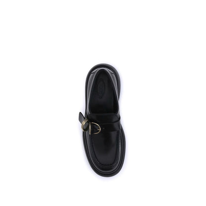 Top view of Tod's Black Rubber Platform Loafers with metal rings and elegant design for a contemporary style.