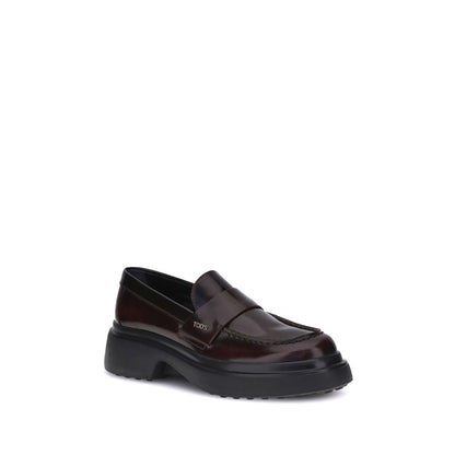 Tod's Brown Rubber Platform Loafers with patent leather, rounded toe, and side logo plaque, featuring a contemporary rubber sole for comfort.