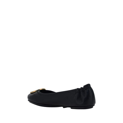 Side view of Tory Burch Black Lamb Ovis Aries Aries Ballet Flats, featuring a slip-on design and embossed monogram plaque.