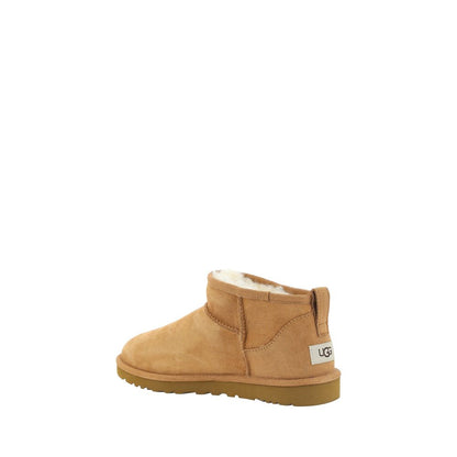 UGG Brown Goatskin Ankle Boots with shearling lining and durable knurled sole, showcasing iconic monogram on heel.