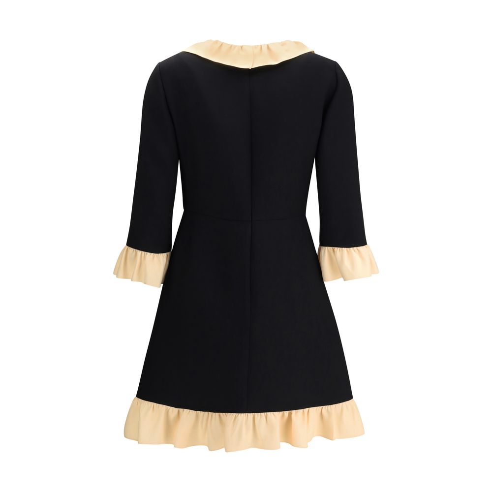 Back view of Valentino Black Fleece Wool Cocktail Dress with cream ruffle detail, featuring three-quarter sleeves and elegant design.