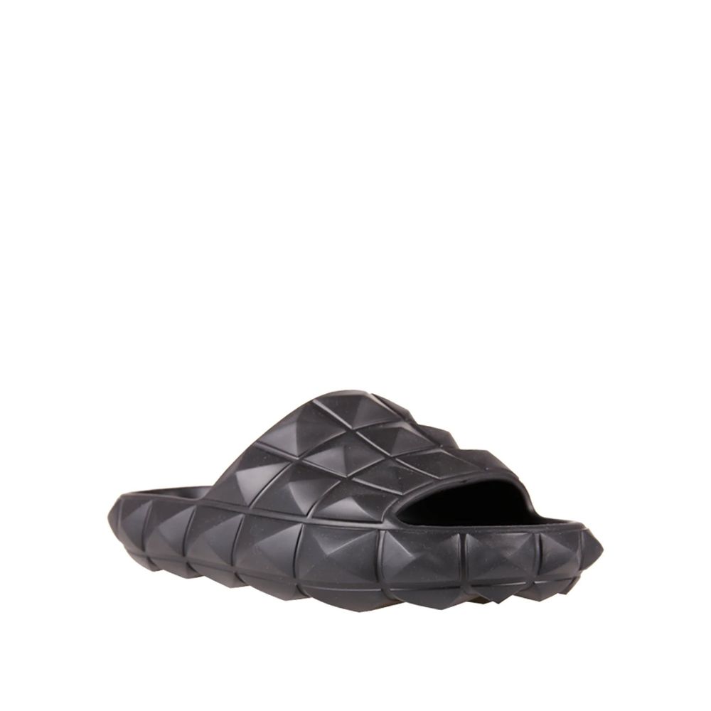 Valentino Garavani Black Rubber Slippers with open toe and rubber studs, made in Italy for men.