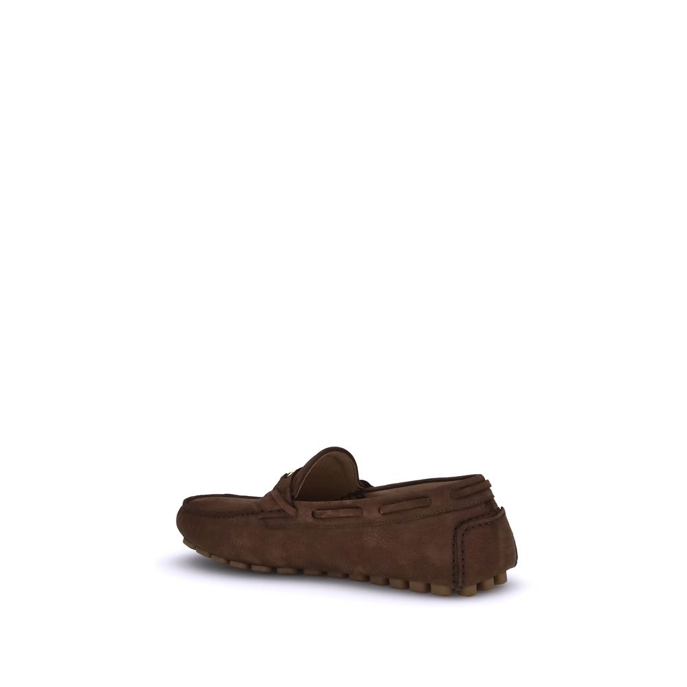 Valentino Garavani Brown Rubber Slip-On Loafers with notched sole for comfort and grip, featuring the iconic VLogo plaque on soft suede leather.