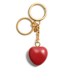 Valentino Garavani Coeur Royal key ring featuring a red heart charm with polished finish, gold keyring attachment. Size: 13 cm length, 3.5 cm width.