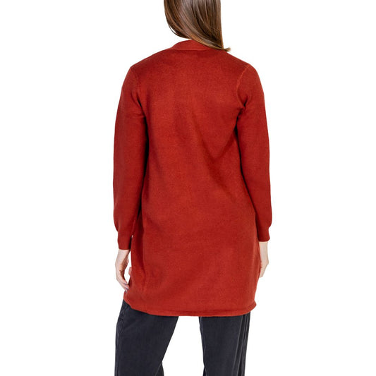 Back view of a woman wearing a Vero Moda Red Viscose Cardigan, part of the women's fall/winter knitwear collection, rich red color.