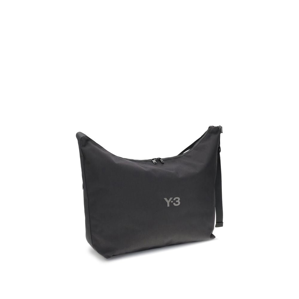 Alt Tag: Y-3 Black Polyamide Shoulder Bag with logo, adjustable strap, and zip closure, minimal style.