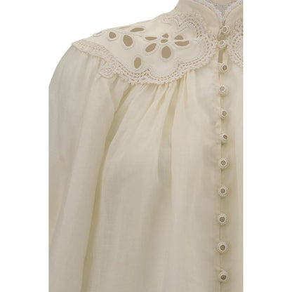 Zimmermann Cream Ramie Blouse with lace inserts and embroidered high neck, featuring covered buttons and elegant scalloped hem.